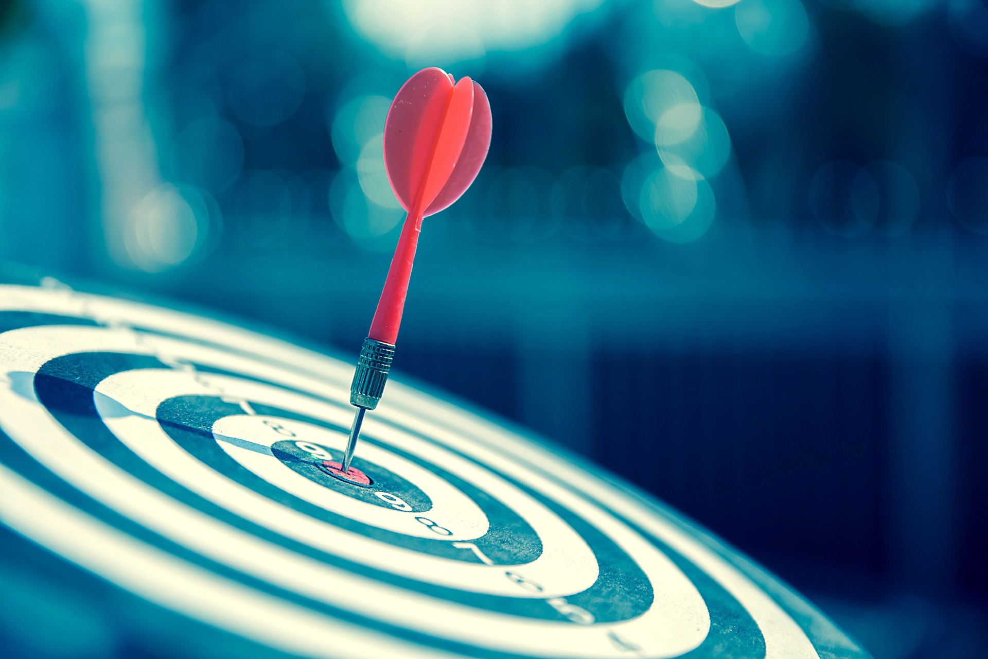 Bullseye or Bulls eye target or dartboard has dart arrow throw hitting the center of a shooting for financial business targeting planning and aim to winner goal of business concept.